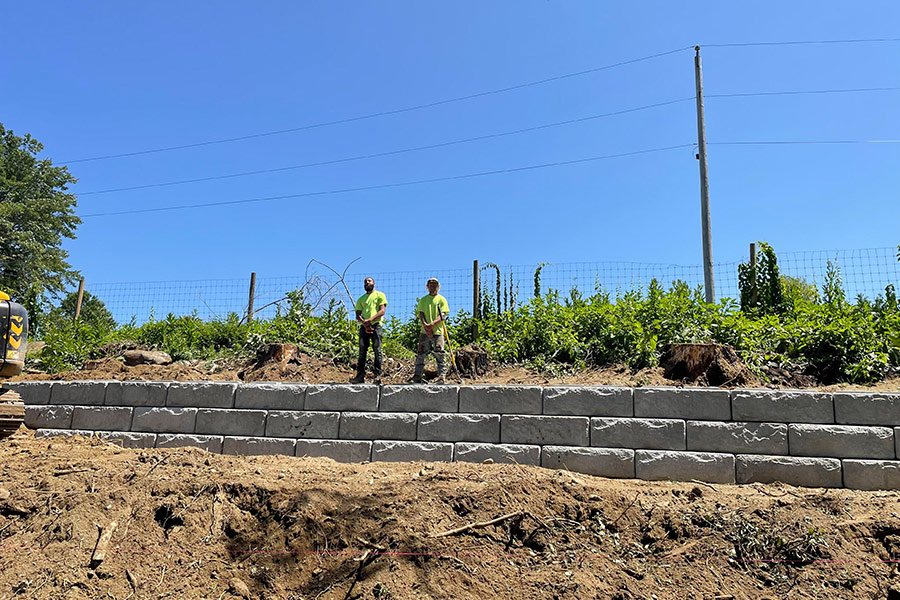 contractor on a retaining wall installed at property worcester ma